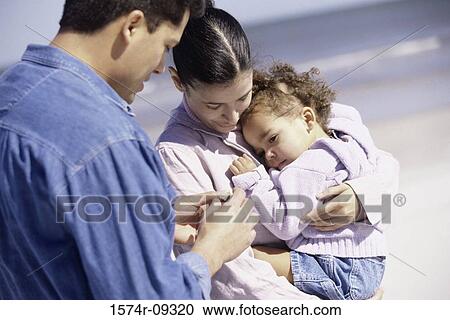 Father and mother on the beach with their daughter View Large Photo Image Stock Image - Father and mother on the beach with their daughter. Fotosearch
