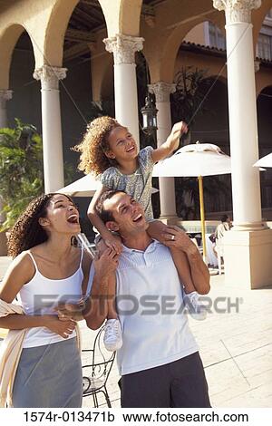 Father carrying his daughter on his shoulders View Large Photo Image Stock Image - Father carrying his daughter on his shoulders. Fotosearch