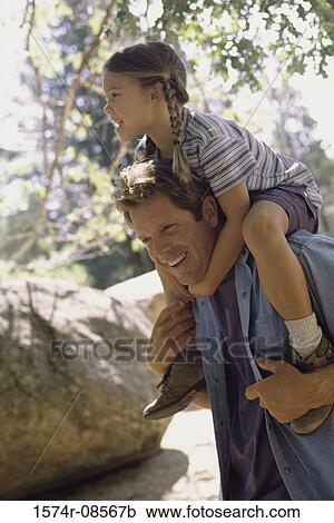 Father carrying his daughter on his shoulders View Large Photo Image Stock Image - Father carrying his daughter on his shoulders. Fotosearch