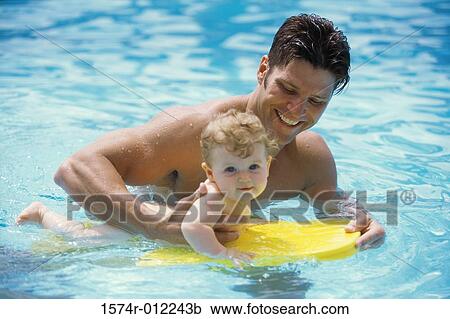 Father in a swimming pool with his baby boy View Large Photo Image Stock Image - Father in a swimming pool with his baby boy. Fotosearch
