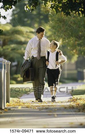 Stock Image - Father walking with his son. Fotosearch