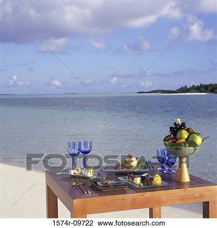 Food served on a table at the beach View Large Photo Image Stock Image - Food served on a table at the beach. Fotosearch