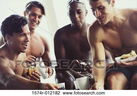 Four young men eating their meals View Large Photo Image Stock Image - Four young men eating their meals. Fotosearch