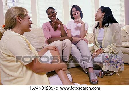 Four young women talking to each other View Large Photo Image Stock Image - Four young women talking to each other. Fotosearch
