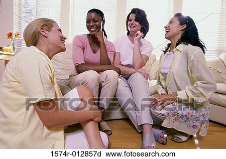 Four young women talking to each other View Large Photo Image Stock Image - Four young women talking to each other. Fotosearch