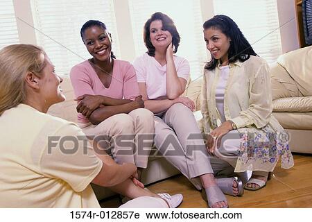 Four young women talking to each other View Large Photo Image Stock Image - Four young women talking to each other. Fotosearch