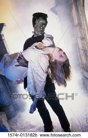 Frankenstein carrying a young woman View Large Photo Image Stock Image - Frankenstein carrying a young woman. Fotosearch