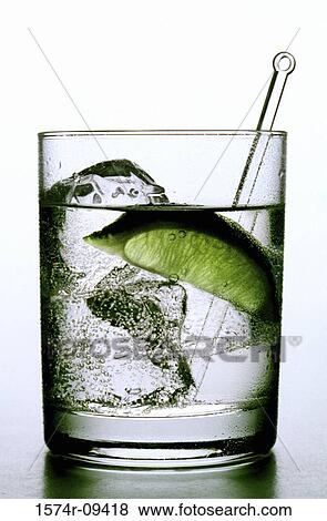 Gin and tonic with a lime wedge View Large Photo Image Stock Photo - Gin and tonic with a lime wedge. Fotosearch
