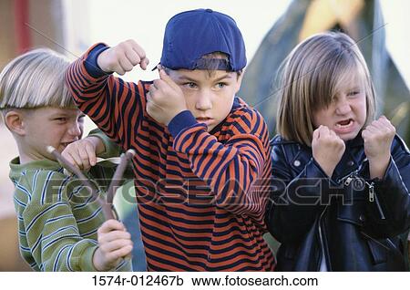 Girl and two boys showing their fists in anger View Large Photo Image Stock Image - Girl and two boys showing their fists in anger. Fotosearch