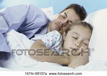 Stock Image - Girl sleeping with her father. Fotosearch