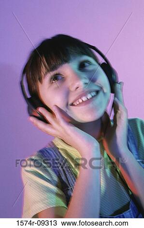 Girl wearing a headset View Large Photo Image Stock Image - Girl wearing a headset. Fotosearch