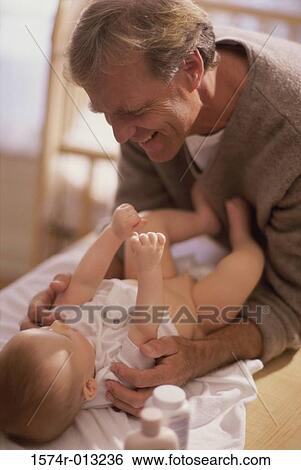 Grandfather playing with his grandson View Large Photo Image Stock Photograph - Grandfather playing with his grandson. Fotosearch