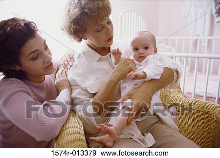 Grandmother with her daughter and granddaughter View Large Photo Image Stock Photo - Grandmother with her daughter and granddaughter. Fotosearch
