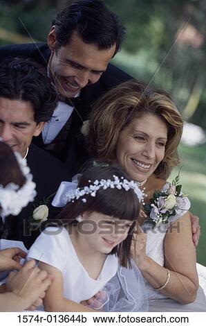 Groom with wedding guests and a flower girl View Large Photo Image Stock Image - Groom with wedding guests and a flower girl. Fotosearch