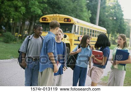Stock Photo - Group of high school students waiting for a school bus. Fotosearch