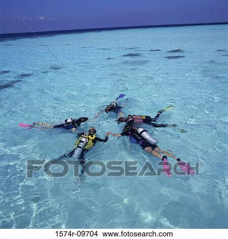 Group of people with scuba gear in the sea View Large Photo Image Picture - Group of people with scuba gear in the sea. Fotosearch