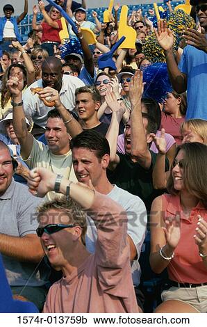 Group of spectators cheering in a stadium View Large Photo Image Stock Image - Group of spectators cheering in a stadium. Fotosearch