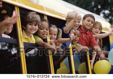 Group of students looking out of a school bus View Large Photo Image Picture - Group of students looking out of a school bus. Fotosearch