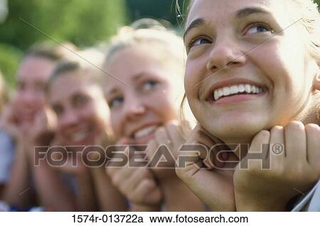 Group of teenage girls looking up View Large Photo Image Stock Image - Group of teenage girls looking up. Fotosearch