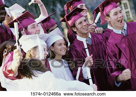 Stock Image - Group of teenage graduates celebrating. Fotosearch