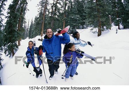 High angle view of a family walking in snow View Large Photo Image Stock Image - High angle view of a family walking in snow. Fotosearch