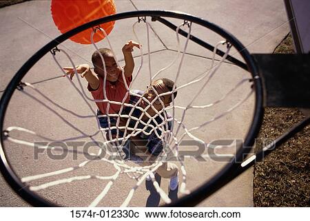 High angle view of a father playing basketball with his son View Large Photo Image Stock Image - High angle view of a father playing basketball with his son. Fotosearch