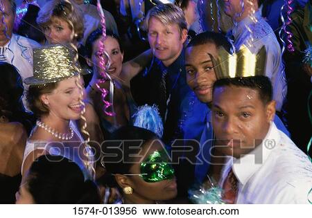 Stock Photograph - High angle view of a group of people dancing at a party. Fotosearch