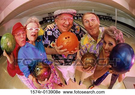 High angle view of a group of senior people holding bowling balls View Large Photo Image Stock Image - High angle view of a group of senior people holding bowling balls. Fotosearch