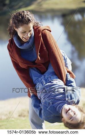 High angle view of a mother playing with her son View Large Photo Image Stock Image - High angle view of a mother playing with her son. Fotosearch