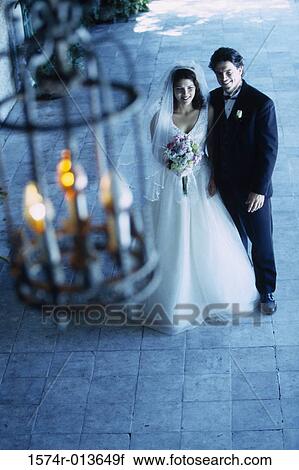 High angle view of a newlywed couple standing together View Large Photo Image Stock Image - High angle view of a newlywed couple standing together. Fotosearch