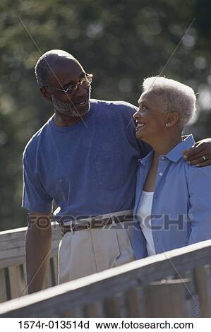 Stock Image - High angle view of a senior couple looking at each other. Fotosearch