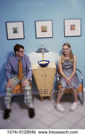 High angle view of a teenage boy and a teenage girl sitting View Large Photo Image Stock Image - High angle view of a teenage boy and a teenage girl sitting. Fotosearch