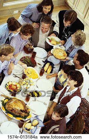 High angle view of a three generation family dining together View Large Photo Image Stock Image - High angle view of a three generation family dining together. Fotosearch