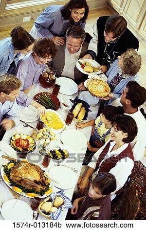 High angle view of a three generation family dining together View Large Photo Image Stock Image - High angle view of a three generation family dining together. Fotosearch