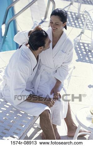 High angle view of a young couple wearing bathrobes View Large Photo Image Stock Image - High angle view of a young couple wearing bathrobes. Fotosearch
