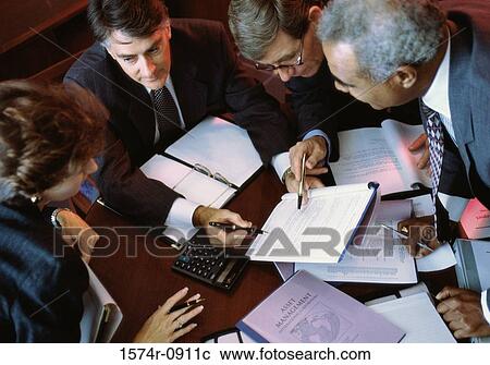High angle view of business executives in a meeting View Large Photo Image Stock Image - High angle view of business executives in a meeting. Fotosearch