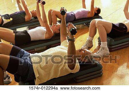 High angle view of five people exercising in a step aerobics class View Large Photo Image Stock Image - High angle view of five people exercising in a step aerobics class. Fotosearch