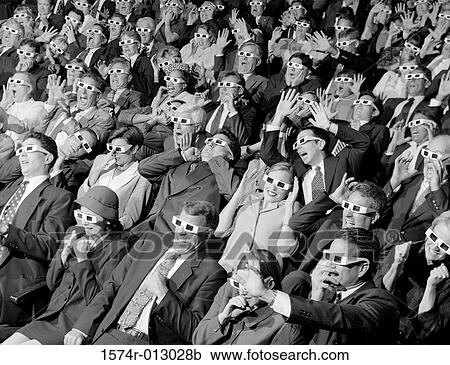 High angle view of group of spectators sitting in a movie theater wearing 3-D glasses View Large Photo Image Stock Image - High angle view of group of spectators sitting in a movie theater wearing 3-D glasses. Fotosearch