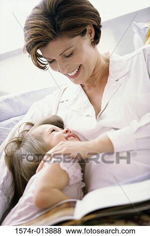 Low angle view of a pregnant woman with her daughter View Large Photo Image Stock Photo - Low angle view of a pregnant woman with her daughter. Fotosearch
