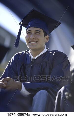 Low angle view of a young male graduate smiling View Large Photo Image Stock Image - Low angle view of a young male graduate smiling. Fotosearch