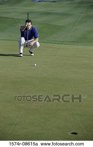 Man aiming with his golf club View Large Photo Image Stock Image - Man aiming with his golf club. Fotosearch