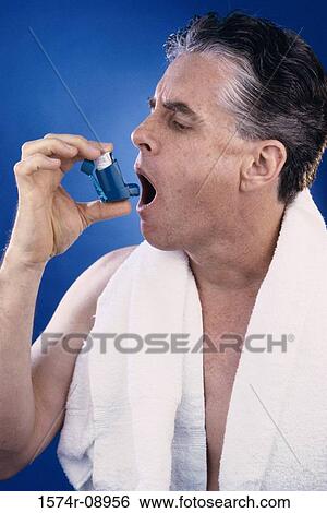 Man using an inhaler View Large Photo Image Stock Photograph - Man using an inhaler. Fotosearch