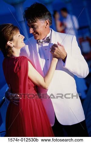 Mature couple dancing on the deck of a cruise ship View Large Photo Image Stock Image - Mature couple dancing on the deck of a cruise ship. Fotosearch