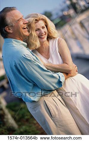 Stock Image - Mature couple embracing each other. Fotosearch