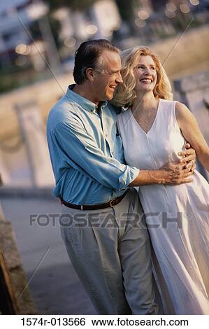 Stock Photograph - Mature couple walking together. Fotosearch