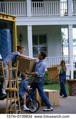 Mid adult couple unloading cardboard boxes from a moving van View Large Photo Image Stock Image - Mid adult couple unloading cardboard boxes from a moving van. Fotosearch