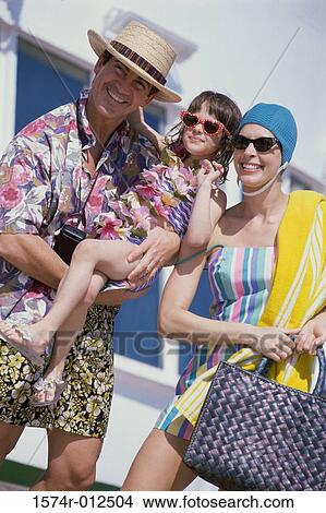 Picture - Mid adult couple with their daughter. Fotosearch