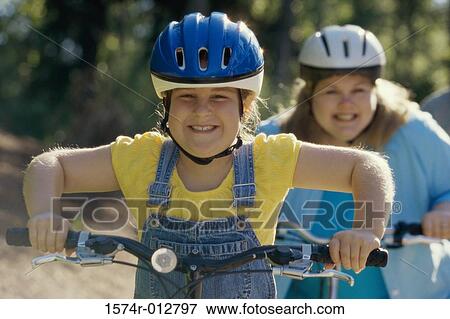 Mother and daughter cycling View Large Photo Image Stock Photo - Mother and daughter cycling. Fotosearch