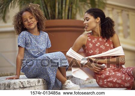 Mother and daughter sitting on steps View Large Photo Image Stock Image - Mother and daughter sitting on steps. Fotosearch
