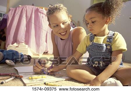 Mother and her daughter writing with crayons View Large Photo Image Stock Photography - Mother and her daughter writing with crayons. Fotosearch